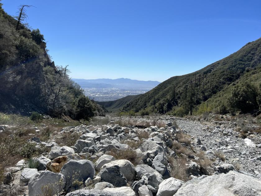 Photo of a rocky valley with blue sky