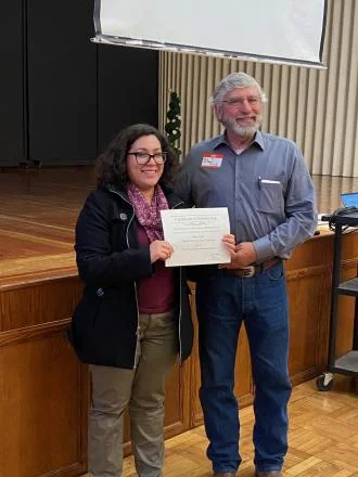 Geological Science student Katya Yanez receiving the award for Outstanding Undergraduate Student