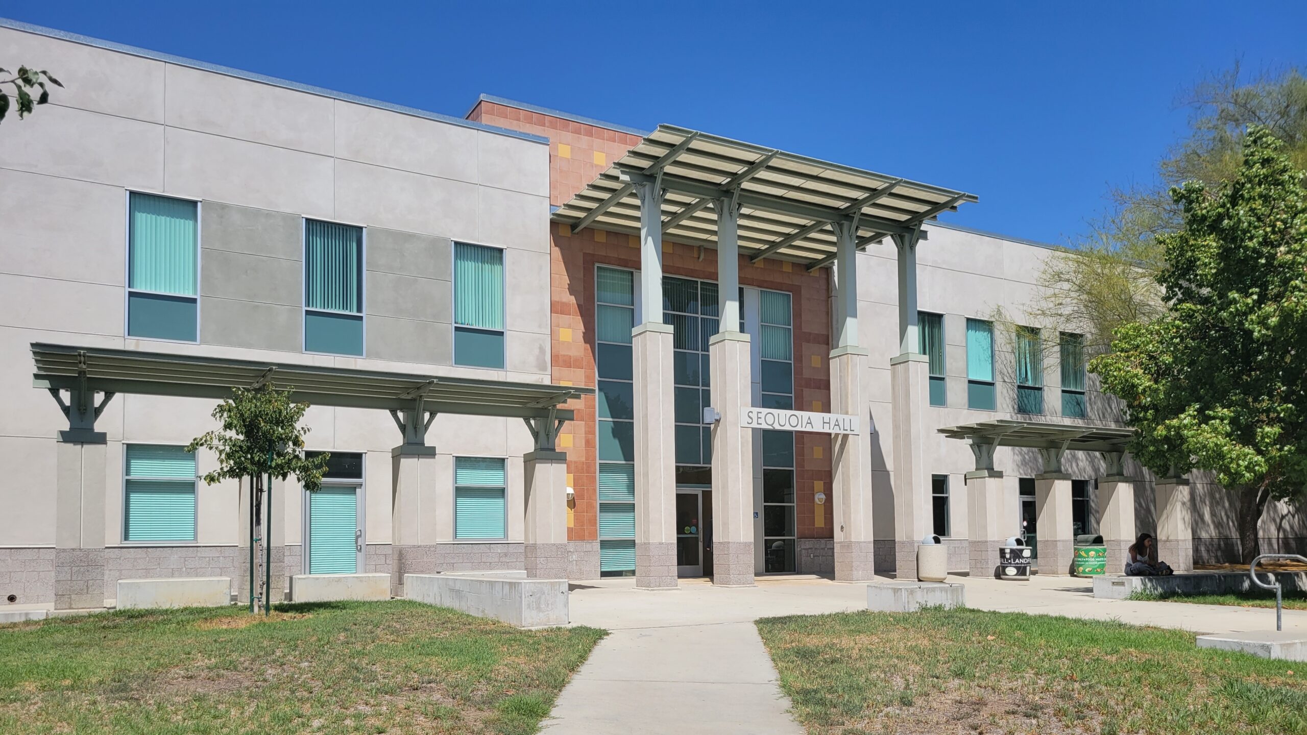 Front of Sequoia Hall building with spacious green lawn