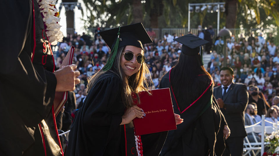 New graduates celebrate at the Commencement ceremony for CSUN's College of Health and Human Development, on May 23, 2022. Photo by David J. Hawkins.