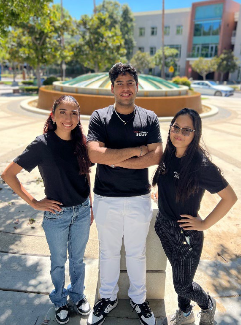 Group of three students stand outside on CSUN campus.