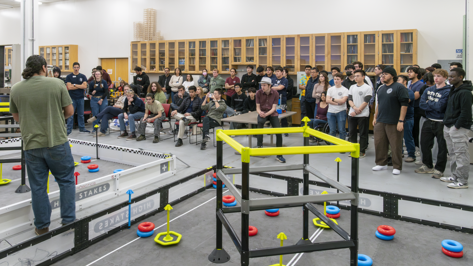 Gathering of everyone during VEX U Competition for rule discussion.