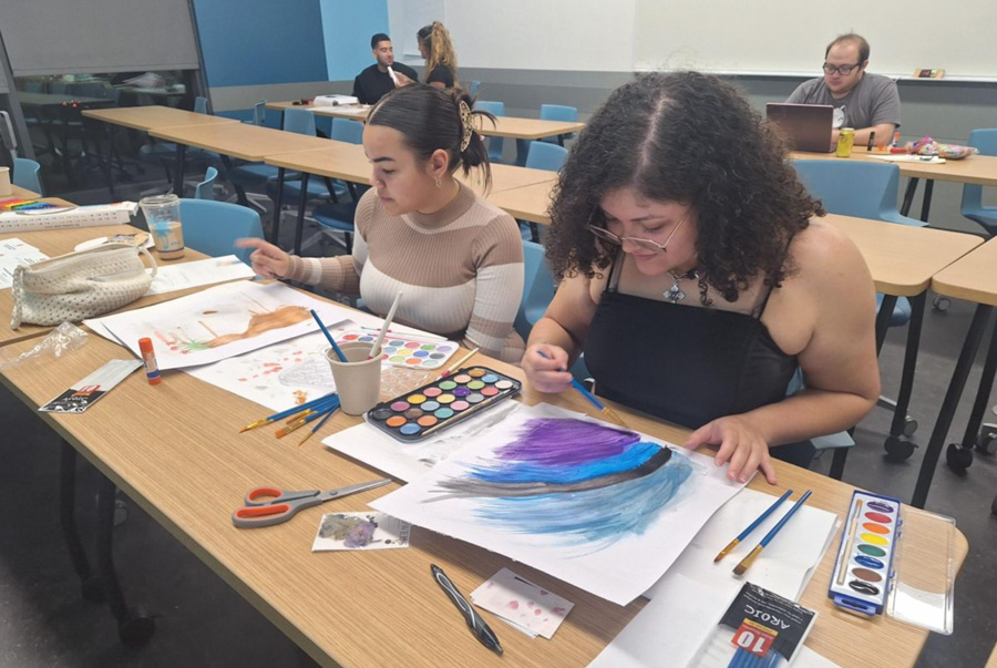 Heaven Calderon (left) and Stephanie Perez (right) enjoy the quietness and relaxing environment of the classroom at the Peacebuilding Through Art-Making Event on Dec. 3 in the Maple Hall at CSUN. Despite Perez not being a student, she expressed her appreciation for the arts and enjoyed spending time with her friend.