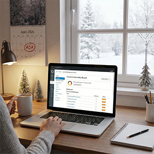 Person working on a laptop at a desk with a snowy view outside the window. Calendar shows April 2026.
