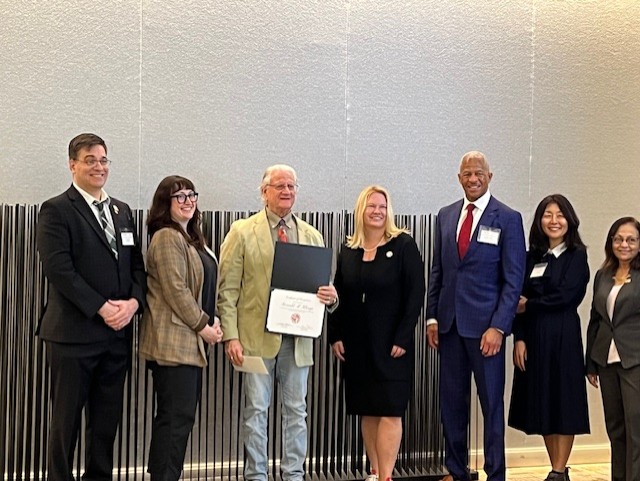 Ron Klemp receiving his certificate for 40 years of service at CSUN