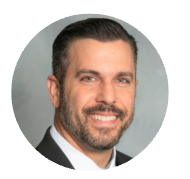 Professional headshot of a man in a suit