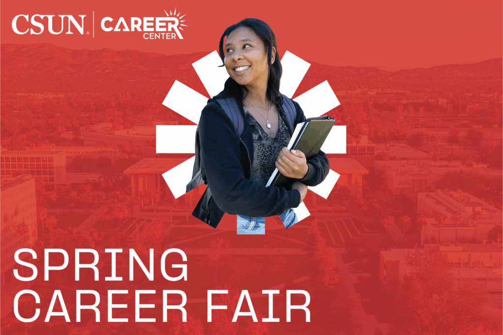 Student smiling holding book bag.