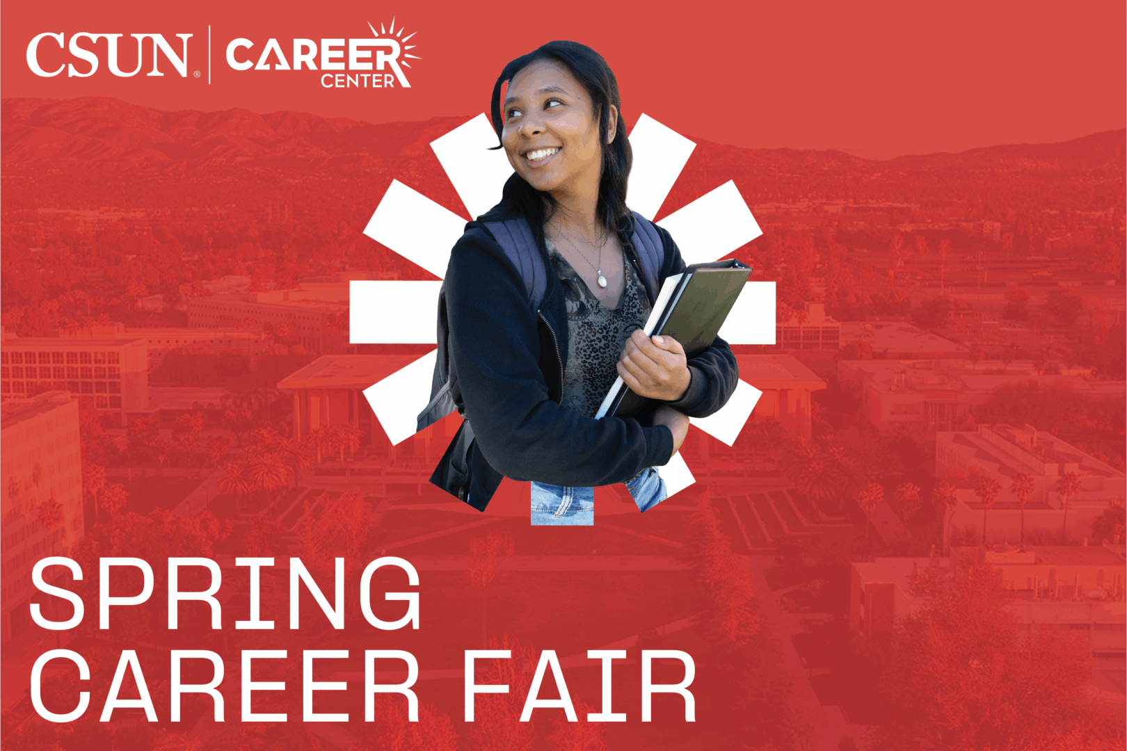 Student smiling holding book bag.
