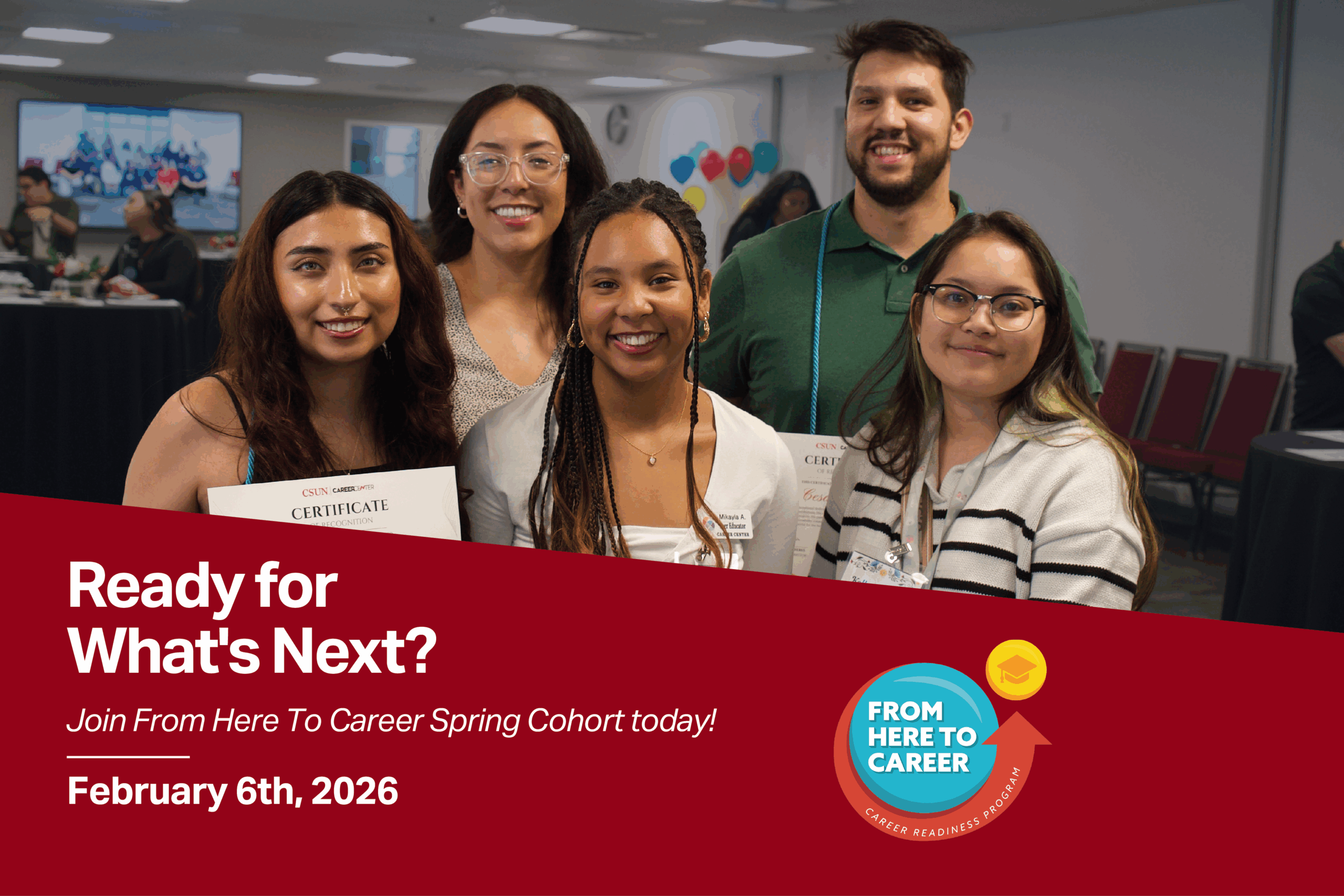 A group of students smiling holding their certificates.