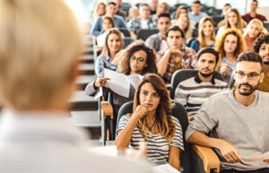 Lecture hall with students listening to a lecture.