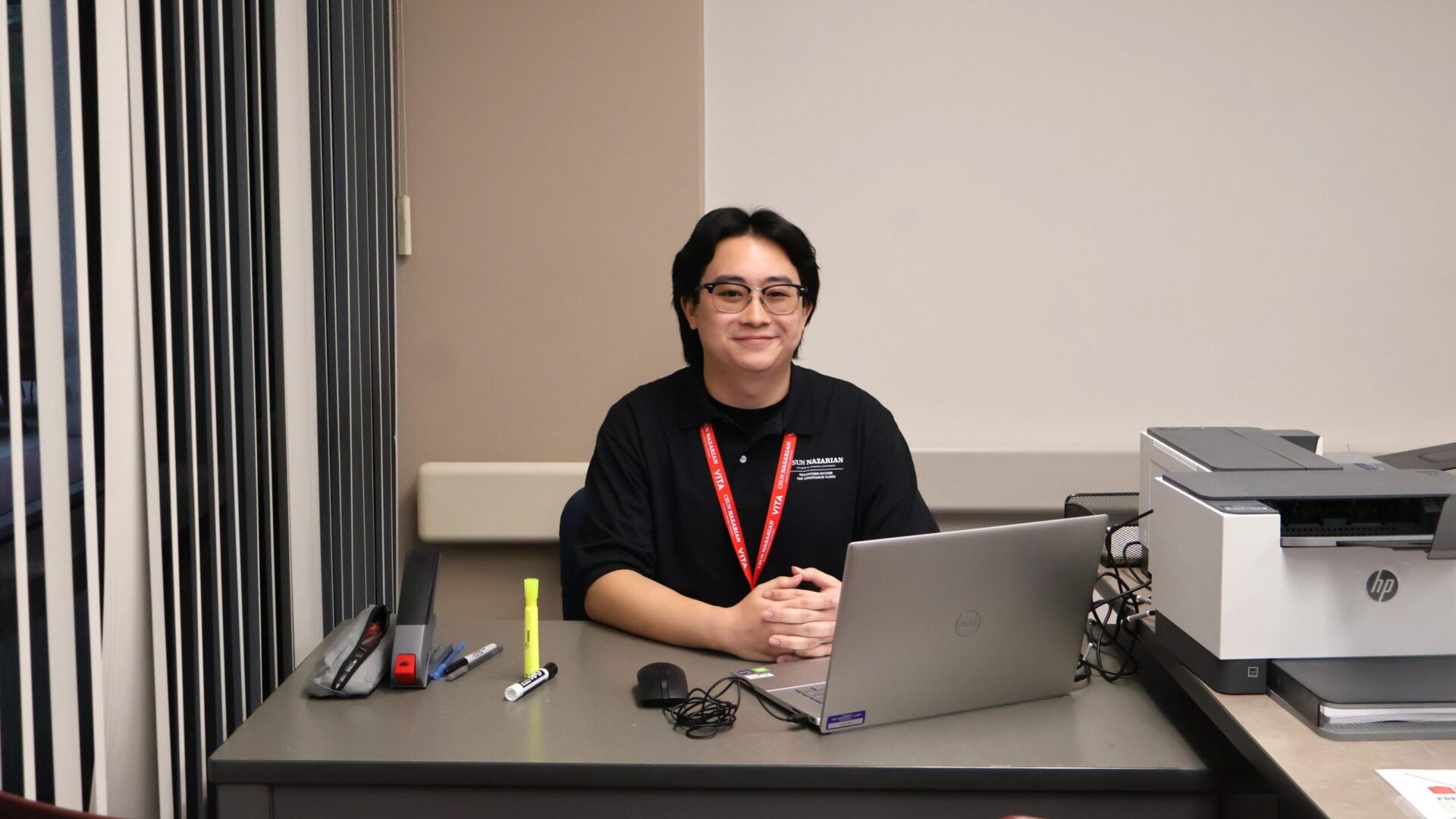 Joshua sitting at his desk.