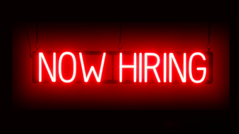 Now Hiring Red neon style text on black background