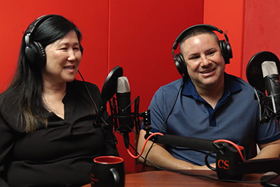 Mira Pak and Dominic Grasso in a studio recording a podcast
