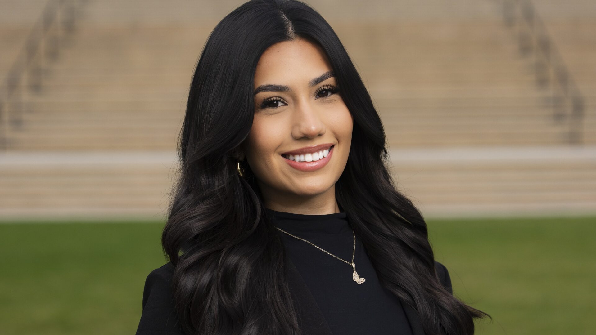 female student smiling and posing for a headshot image
