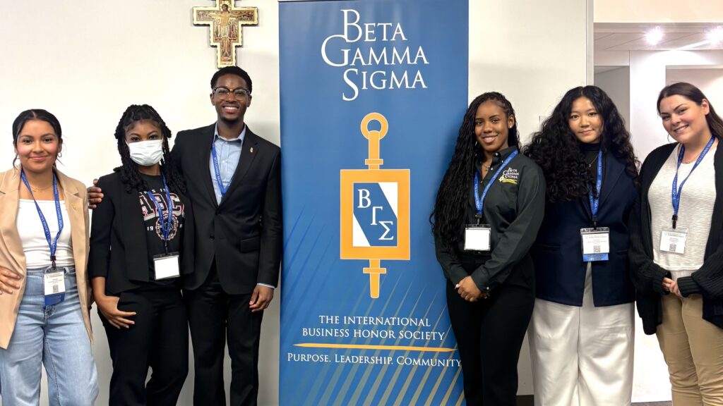 Group of Beta Gamma Sigma students standing and smiling