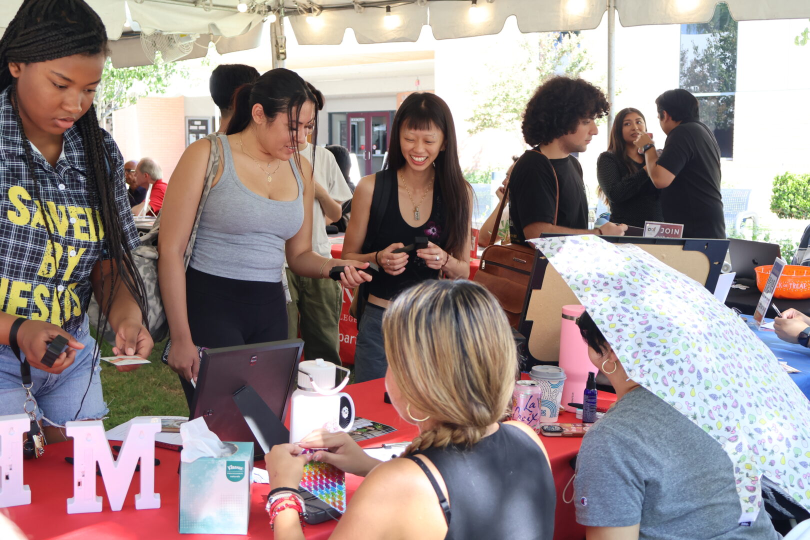 Students talking with faculty and others at Nazarian College Fair